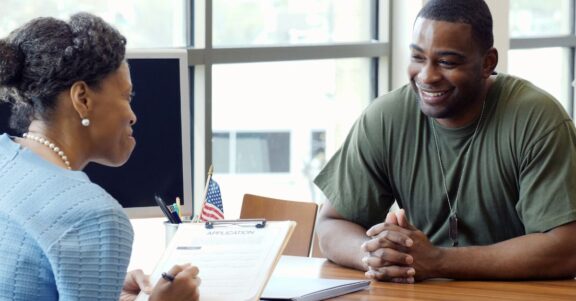 active duty military member discussing potential job opportunity with recruiter military appreciation
