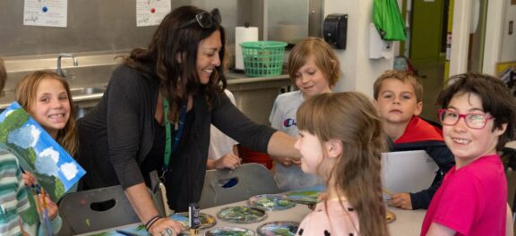 art class group of student working with teacher at Cascades Academy