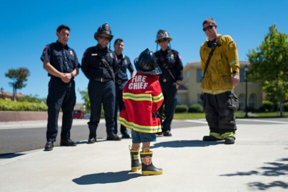 community event at local fire station boy showing firefighter appreciation courtesy of hamza el falah 7weSMis6n3M unsplash