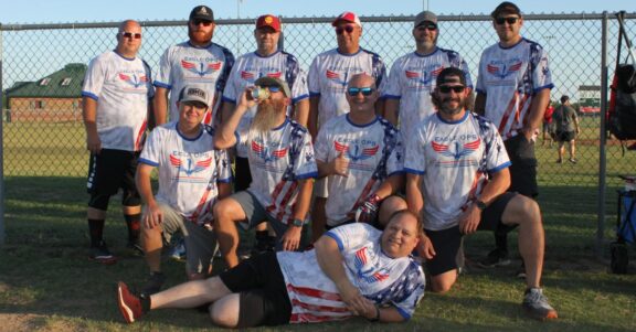 Eagle OPS Foundation softball team photo at field