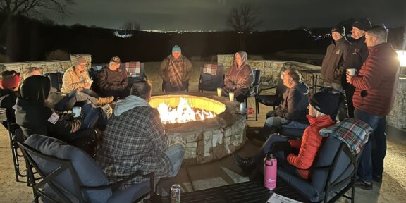 Eagle OPS Rally Point participants around evening bonfire sharing time together