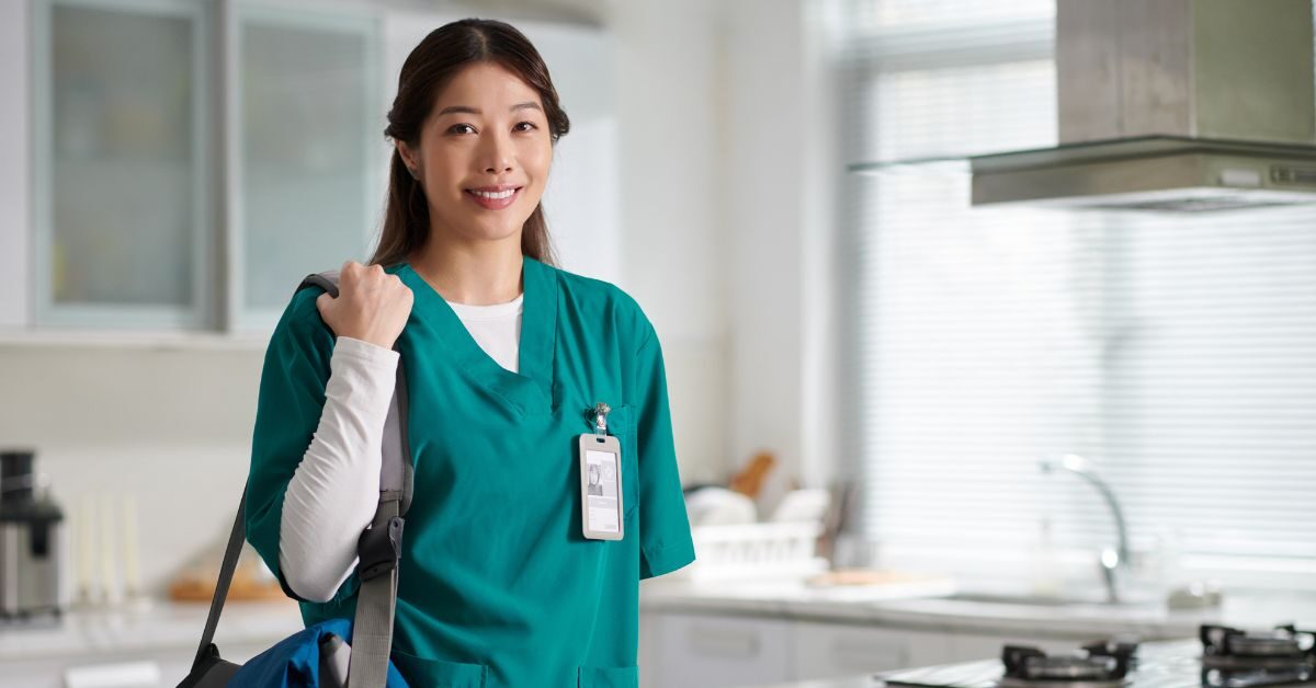 nurse in scrubs leaving new home purchased with FHA loan in kitchen carrying duffle bag for work