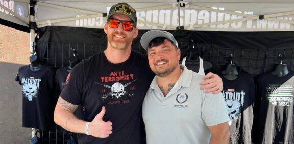 Stephan Swarner Operation 22 with booth vender at event