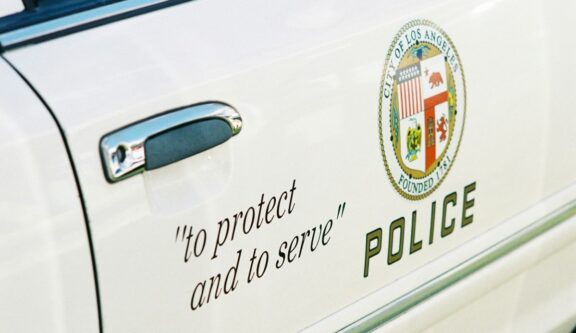to protect and to serve motto emblem on police car Los-Angeles nick-page-ztzdRrypGQY-nsplash