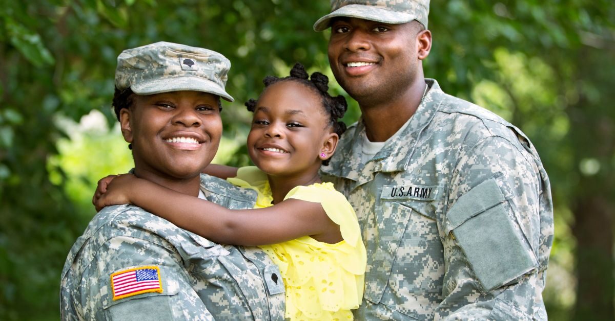 U.S. army mom dad child military family smiling outside